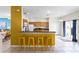 Kitchen with breakfast bar and connection to the dining and outdoor areas at 814 Bloomingdale Dr, Davenport, FL 33897