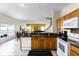 Well-lit kitchen showcasing appliances, counter space, and a breakfast bar at 814 Bloomingdale Dr, Davenport, FL 33897