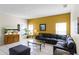 Cozy living room with tile flooring, ample seating, and natural light at 814 Bloomingdale Dr, Davenport, FL 33897