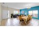 Inviting living room features tile floors, a dining area, and natural light at 814 Bloomingdale Dr, Davenport, FL 33897