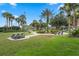 A serene park with seating, picnic tables, and greenery, perfect for community gatherings and relaxation at 814 Bloomingdale Dr, Davenport, FL 33897