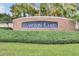 Hampton Lakes community sign amid manicured greenery and palm trees at 814 Bloomingdale Dr, Davenport, FL 33897