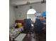 Bedroom or office space with wood-look flooring, arched window, and desk at 907 Gloucester Ct, Kissimmee, FL 34758