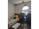 Bedroom or office space with wood-look flooring, arched window, and desk at 907 Gloucester Ct, Kissimmee, FL 34758