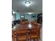 Dining room with large table and chairs visible to the living room at 907 Gloucester Ct, Kissimmee, FL 34758