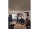 Well-equipped home gym featuring various machines for a complete workout at 907 Gloucester Ct, Kissimmee, FL 34758