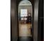Hallway leading to bathroom and showing window with natural light at 907 Gloucester Ct, Kissimmee, FL 34758