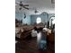 Spacious main bedroom with hardwood floors and ample seating with an arched window at 907 Gloucester Ct, Kissimmee, FL 34758