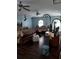 Spacious main bedroom with hardwood floors and ample seating with an arched window at 907 Gloucester Ct, Kissimmee, FL 34758
