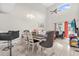Bright dining room with a high ceiling, tile floors, chandelier, and ample seating at 1225 Coral Coast Dr, Orlando, FL 32824
