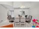 Inviting dining room featuring a view into the kitchen and ample space for entertaining at 1225 Coral Coast Dr, Orlando, FL 32824
