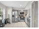 Functional kitchen featuring stainless steel appliances, tile flooring, and ample cabinet space at 1225 Coral Coast Dr, Orlando, FL 32824