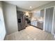 Bright kitchen features stainless steel appliances, white subway tile backsplash, and light gray cabinets at 1225 Coral Coast Dr, Orlando, FL 32824