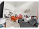 Open-concept living space featuring tile flooring, modern furniture, and natural light at 1225 Coral Coast Dr, Orlando, FL 32824