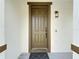 Close-up of an inviting front door with sidelight and modern lighting at 178 Forest View Dr, Davenport, FL 33896