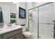 A clean and bright bathroom with a glass shower, modern fixtures, and neutral decor at 3704 Via Monte Napoleone Dr, Poinciana, FL 34759