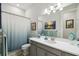 A simple bathroom with a shower and vanity at 3704 Via Monte Napoleone Dr, Poinciana, FL 34759