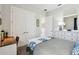 A calm bedroom with a plush bed, closet, and a view of the bathroom at 3704 Via Monte Napoleone Dr, Poinciana, FL 34759