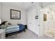 Bright bedroom featuring a twin bed with striped bedding and a double door closet at 3704 Via Monte Napoleone Dr, Poinciana, FL 34759