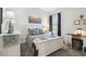 A beautifully decorated bedroom with a white bed frame, stylish bedding, and ample natural light at 3704 Via Monte Napoleone Dr, Poinciana, FL 34759