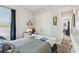 A bright bedroom featuring a comfortable bed, closet, and a view of the hallway at 3704 Via Monte Napoleone Dr, Poinciana, FL 34759