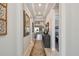 Inviting hallway with tray ceilings leading to the living room and bedroom at 3704 Via Monte Napoleone Dr, Poinciana, FL 34759