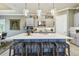 Spacious kitchen with a large island, modern cabinetry, and stylish barstool seating at 3704 Via Monte Napoleone Dr, Poinciana, FL 34759