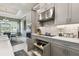 Modern kitchen with pull out drawer storage, stainless steel appliances and adjacent dining area at 3704 Via Monte Napoleone Dr, Poinciana, FL 34759