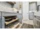 Beautiful kitchen with custom pull out drawer storage and modern appliances at 3704 Via Monte Napoleone Dr, Poinciana, FL 34759