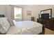 Bedroom with carpet, dark wood furniture, and window views at 423 Corvina Dr, Davenport, FL 33897