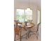 Cozy dining area bathed in natural light, perfect for enjoying meals with Gathering and friends with views of the backyard at 423 Corvina Dr, Davenport, FL 33897
