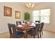 Elegant dining room featuring sophisticated decor and ample seating, perfect for hosting memorable gatherings and dinner parties at 423 Corvina Dr, Davenport, FL 33897