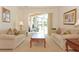 Bright living room with sliding glass doors leading to an outdoor area, bringing the outdoors in and filling the space with light at 423 Corvina Dr, Davenport, FL 33897