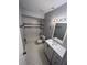 Well-lit bathroom with white tiled shower-tub, vanity with sink, and modern fixtures at 5226 Via Hacienda Cir # A314, Orlando, FL 32839