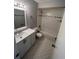 A modern bathroom with a shower-tub combination, white vanity, and tile flooring at 5226 Via Hacienda Cir # A314, Orlando, FL 32839