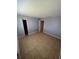 A spacious bedroom with tile flooring, a closet, and fresh, neutral paint at 5226 Via Hacienda Cir # A314, Orlando, FL 32839