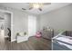 Comfortable bedroom with ceiling fan has space for playing and storage at 1031 Wood Cv, Kissimmee, FL 34743