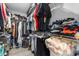 Walk-in closet is organized with custom shelving and space for accessories at 1031 Wood Cv, Kissimmee, FL 34743