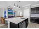 Elegant kitchen featuring an island, stainless steel appliances, and pendant lighting at 1031 Wood Cv, Kissimmee, FL 34743