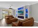 Cozy living area with a fireplace, sliding glass doors, and stylish decor at 1031 Wood Cv, Kissimmee, FL 34743