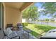 Enjoy the outdoors on this patio with comfortable seating and a beautiful view of the lake at 1031 Wood Cv, Kissimmee, FL 34743