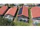 Aerial shot highlighting solar panels and screened-in pools in a residential neighborhood at 1102 Solana Cir, Davenport, FL 33897