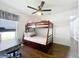 Bedroom with bunk bed, a desk, and a ceiling fan at 1102 Solana Cir, Davenport, FL 33897