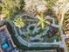 Aerial view of a fun miniature golf course with landscaping and meandering paths at 1102 Solana Cir, Davenport, FL 33897