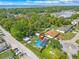 A stunning aerial view showcases this home with its pool and solar panels at 1204 Pleasant Pl, Lakeland, FL 33801