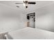 Bedroom featuring a ceiling fan, closet, and adjacent door at 1204 Pleasant Pl, Lakeland, FL 33801