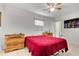Neutral bedroom featuring a ceiling fan, tile floor, and decorations at 1204 Pleasant Pl, Lakeland, FL 33801