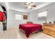 Bright bedroom with a ceiling fan, neutral paint, tile floor, and closet at 1204 Pleasant Pl, Lakeland, FL 33801