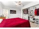 Bright bedroom featuring a ceiling fan, tile floor, and closet at 1204 Pleasant Pl, Lakeland, FL 33801