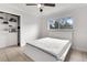 Bedroom featuring a ceiling fan, window, and built in closet at 1204 Pleasant Pl, Lakeland, FL 33801